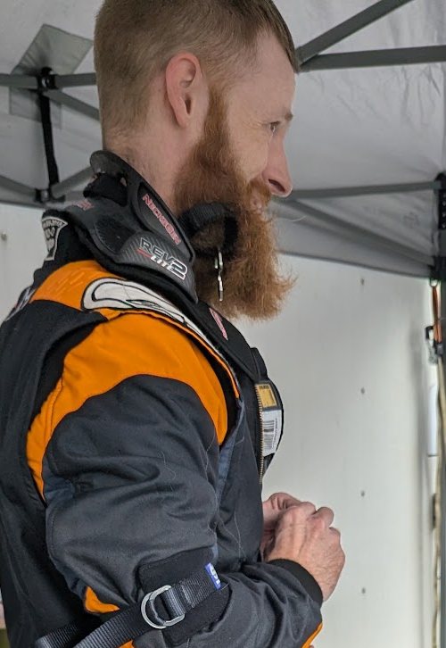 Bill suited up in the paddock, side view
