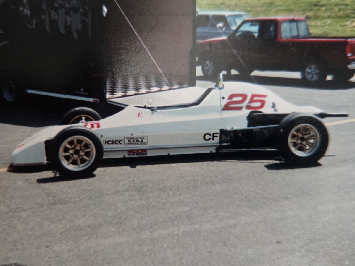 The car in white as number 25, with ICSCC and SCCA club racing decals